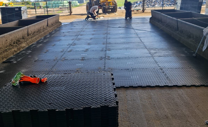 X Grip Tiles being installed on a farm